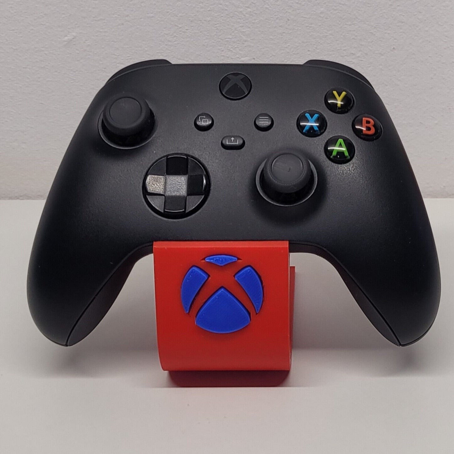 Soporte stand expositor mando Xbox one/series. Envíos a todo el mundo